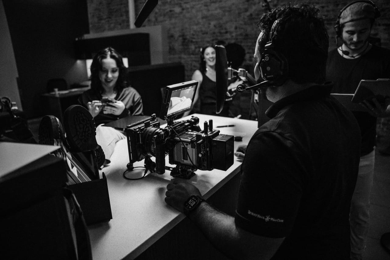 Black and white studio shoot with crew and cameras